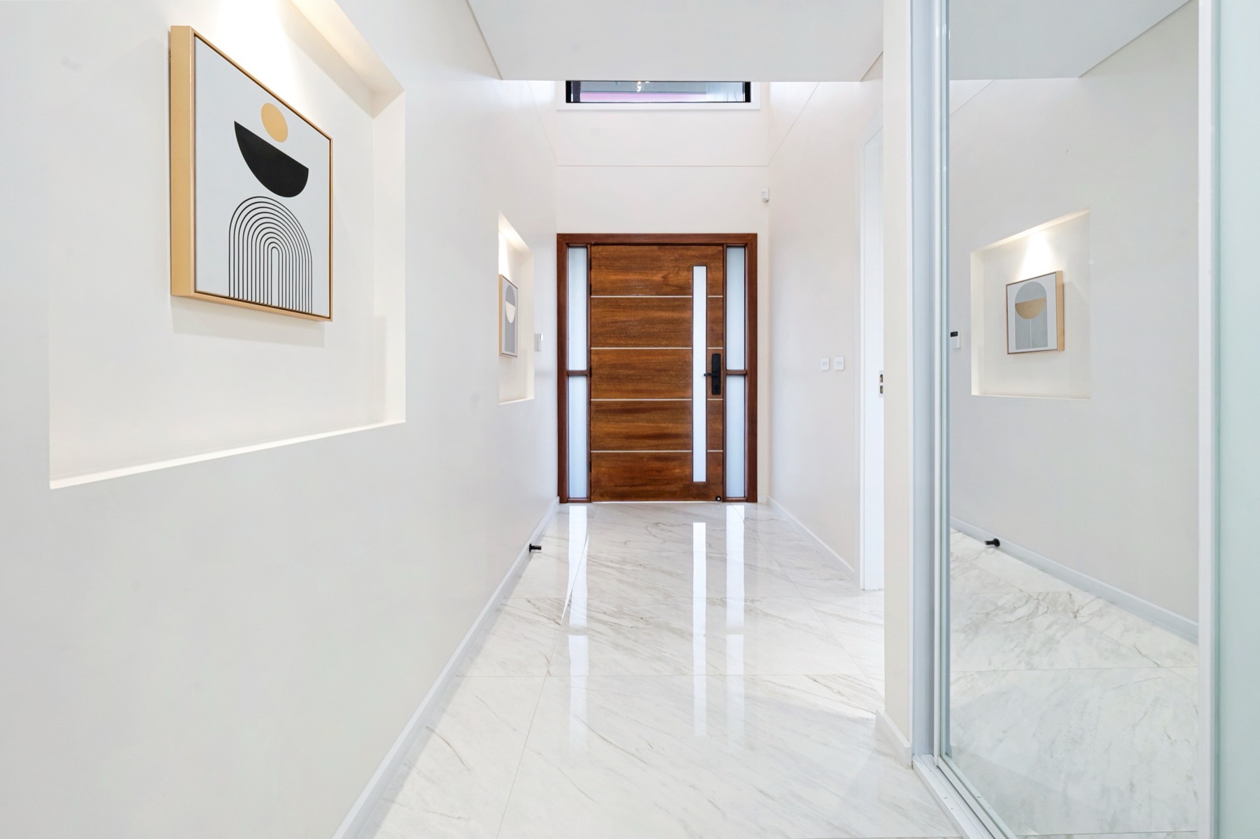 Sydney TCE entry hallway with timber front door and display niches