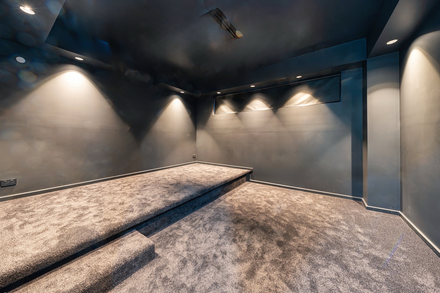 Sydney TCE theatre room with tiered seating platform and feature lighting